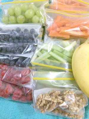 FROM MELANIE GUPTA: Snack packs made for the week! I keep rotating them. The past few weeks I've made bags of cucumber, carrot, mixed peppers, cherry tomatoes, celery, trail mix, cheese, walnuts, mixed nuts, grapes, protein bars, granola, eggs, turkey slices and every berry under the sun. Savvy note: Save money by purchasing snack bags at the Dollar Tree and bag up your own snacks. Don't pay for the convenience of pre-packaged foods. Putting them in snack-size bags also helps you control the portion sizes.