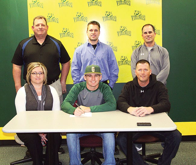 Chase Alexander of Centreville recently committed to play baseball at Glen Oaks Community College. He is pictured front with mom Jennel Schultz and father Terry Alexander. Back row Centreville athletic director Perry Baranic, Bulldog baseball coach Mike Webster and Glen Oaks coach Keith Schreiber.