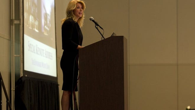 Texas Sen. Wendy Davis, D-Fort Worth, said Republican Attorney General Greg Abbott wants to make the gubernatorial election a referendum on a “mischaracterization” about her past.