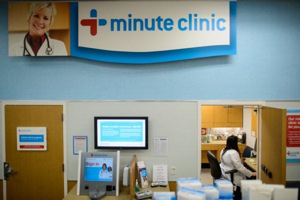 Nurse Lynne Mabe works on a computer in an exam room at the MinuteClinic inside a CVS Pharmacy on Owen Drive.