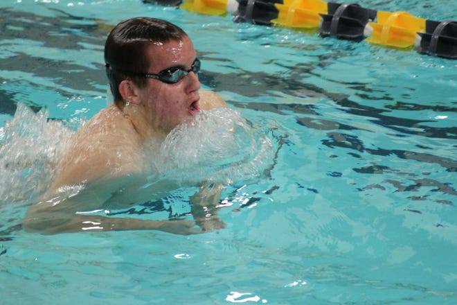 B-R swimmer Zach Souza plows through the pool. Souza took first place in the 200 IM & 100 Back in the Trojans’ 87-82 victory over Nauset.

Courtesy Photo