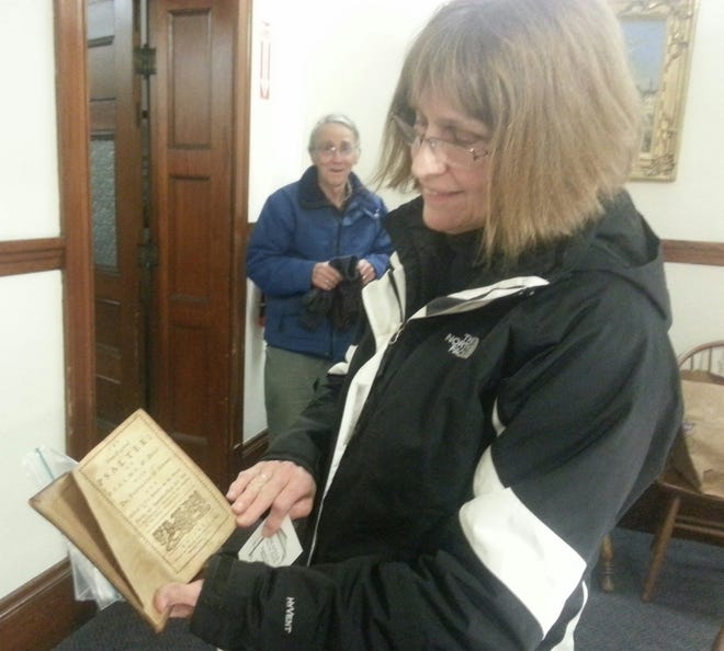 Salter/Democrat photo

Barrington resident JoAnn Pearson shows off her copy of a Book of Psalters printed in Boston in 1773.