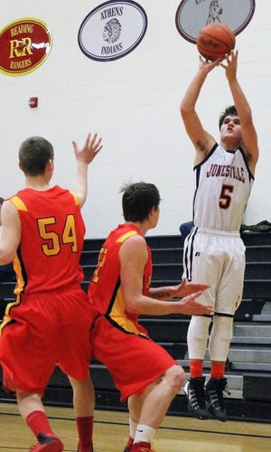 Jonesville's Aaron Cleveland pulls up from three. Cleveland finished with 12 points. Phil Morgan Photo