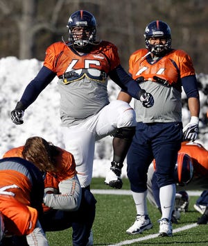 Denver Broncos guard Louis Vasquez (65) stretches during practice Wednesday, Jan. 29, 2014, in Florham Park, N.J. The Broncos are scheduled to play the Seattle Seahawks in the NFL Super Bowl XLVIII football game Sunday, Feb. 2, in East Rutherford, N.J. (AP Photo/Mark Humphrey)