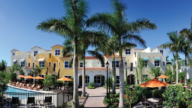 The historical townhomes sit adjacent to the Palm Beach-inspired pool garden at Villas on Antique Row.