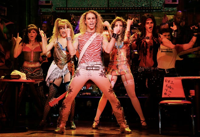 Joey Calveri, center, is Stacee Jaxx in a scene from "Rock of Ages," in New York. The cast of the Broadway show will be part of the televised pregame entertainment before Sunday's Super Bowl on Feb. 2.