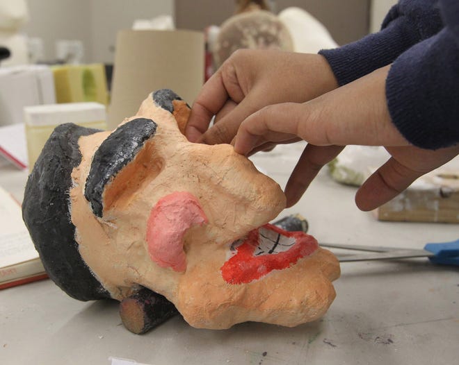 Regina Satayathum sculpts the face of her puppet "Herbert the Pervert" during the Hiram College 3-week Introduction to Puppetry course at the Performing Arts Building in Hiram, Ohio.