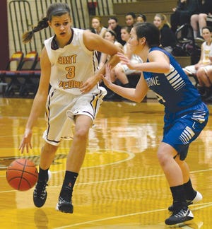 Kylie Giebelhausen, left, an East Peoria senior shown in a December game, had 30 points last week in the team's Mid-Illini Conference girls basketball victories over Pekin and Dunlap. The Raiders improved to 15-7 overall.
