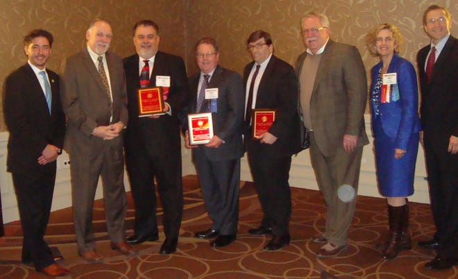 The Middlesex 3 Coalition won the Regional Economic Development Public/Private Partnership Innovation Award at the Massachusetts Municipal Association's annual meeting. From left: incoming MMA president Kevin Dumas, former Billerica and Burlington Town Manager Bob Mercier, Burlington Town Manager John Petran, Bedford Town Manager Rick Reed, Billerica Town Manager John Curran,

M3 director and founder Bob Buckley, outgoing MMA president Kate Fitzpatrick, and MMA Executive Director Geoff Beckwith. WICKED LOCAL PHOTO/MARY K. MCBRIDE