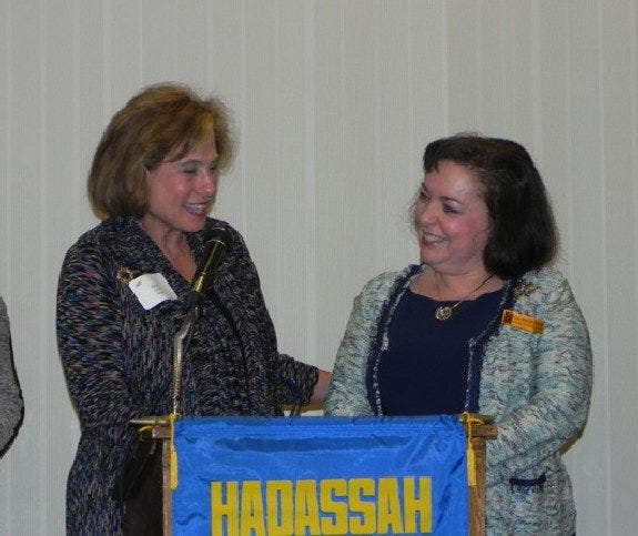 Past National President Nancy Falchuk (left) installs Susan Shikora, a past president of the Sharon Stoughton Chapter of Hadassah, as president of the Southern New England Region of Hadassah at Temple Israel in Sharon.

Courtesy photo