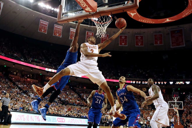 Texas' Demarcus Holland puts up a shot against Kansas on Saturday. Texas' upset victory makes it one of the hottest teams in the country after six consecutive wins.