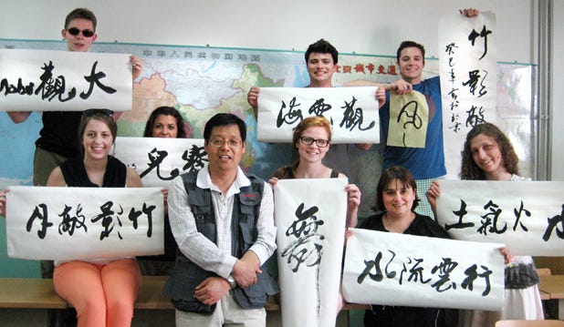 Lake Superior State University students pose with their favorite words written in Chinese after a calligraphy workshop taught at Beijing University of Technology in June 2013. LSSU is again offering a faculty-led study abroad program at Beijing Tech, May 5-June 10, which includes a 13-day tour of historic and scenic attractions in five popular tourist destinations, including Beijing, Xi’an, Shanghai, Hangzhou and Suzhou. From left are Mark Stephenson (literature major from Atlanta, Mich.), Morgan Laundy (accounting/international business; Sault Ste Marie, Mich.), Jene St. Amour (liberal studies/general business/marketing; Sault Ste Marie, Mich.), the calligraphy instructor, Noel Granger (dual majors in liberal studies and business administration/marketing; Fraser, Mich.), Nicolas Talentino (athletic training; Sault Ste. Marie, Mich.), Tina VanAlstine (accounting, Sault Ste. Marie, Mich.), Anson Kraiger (nursing; Galesburg, Mich.), and Chelsea Olander (integrated elementary science education; Wild Rose, Wisc).