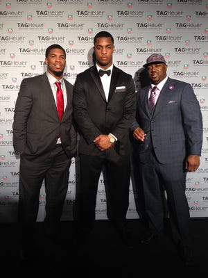 New Bern native Kevin Reddick (left) and Kinston’s Quinton Coples (middle), along with manager Kurtis Stewart, join in the Super Bowl celebration in New York City. Reddick plays in the National Football League with the New Orleans Saints and Coples is a member of the New York Jets.