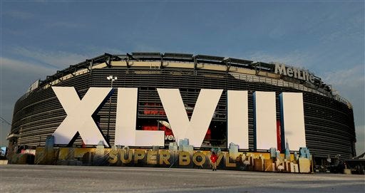 A sign for NFL football's Super Bowl XLVIII stands in front of MetLife Stadium Sat. Feb. 1, 2014, in East Ruthoford, N.J. The stadium will be the site of Sunday's championship game between the Denver Broncos and the Seattle Seahawks.