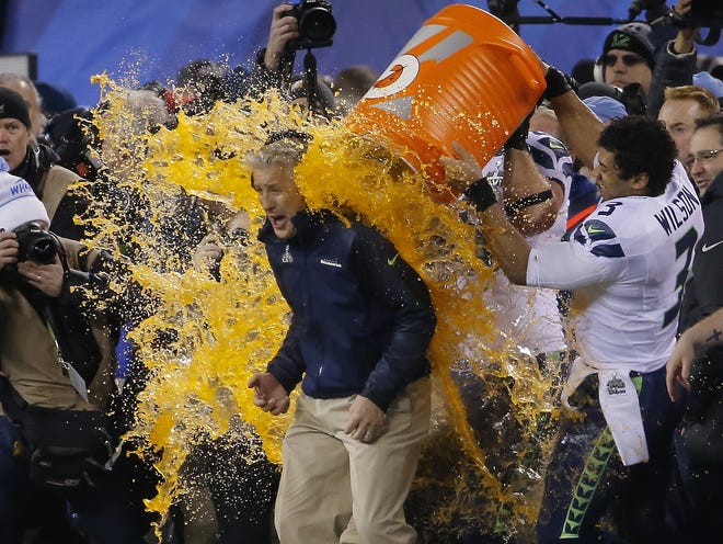 Seattle Seahawks quarterback Russell Wilson (3) dumps Gatorade on head coach Pete Carroll late in the Super Bowl on Sunday in East Rutherford, N.J.