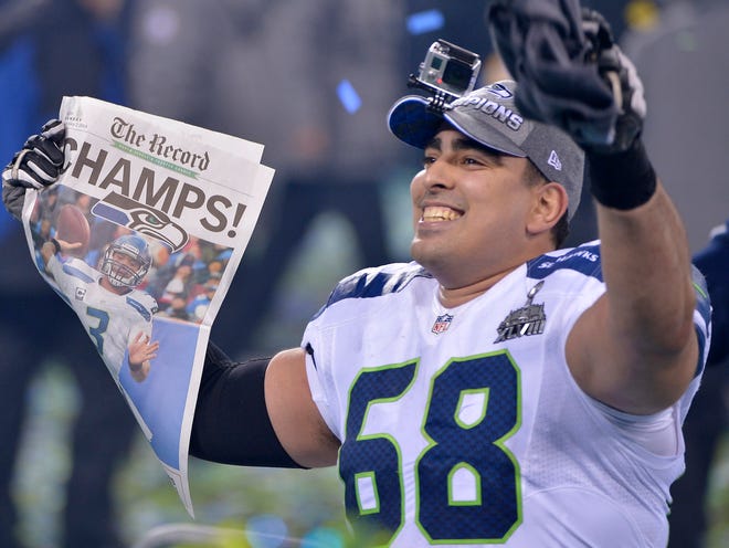 Seattle Seahawks' Breno Giacomini (68) celebrates after the NFL Super Bowl XLVIII football game against the Denver Broncos Sunday, Feb. 2, 2014, in East Rutherford, N.J. The Seahawks won 43-8.