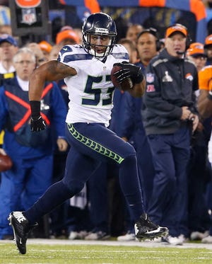 Seattle Seahawks' Malcolm Smith (53) was the third linebacker in NFL history to be named MVP for his performance in the Super Bowl.
