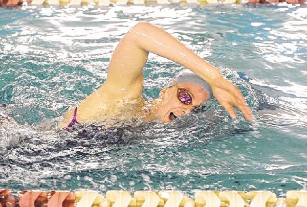 Nauset’s Marie Chamberlain, shown here earlier this season, set three school records and one league record at the Bay Colony Conference Swimming Championship at Bridgewater State University on Sunday.