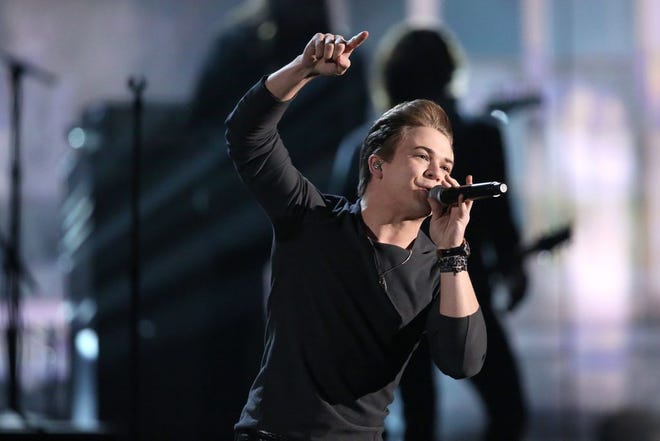 Hunter Hayes performs "Invisible" on stage at the 56th annual Grammy Awards at Staples Center on Sunday, Jan. 26, 2014, in Los Angeles. (Photo by Matt Sayles/Invision/AP)