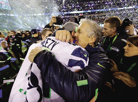 Seattle Seahawks head coach Pete Carroll celebrates with lineman J.R. Sweezy, left, after Super Bowl XLVIII against the Denver Broncos on Sunday in East Rutherford, N.J. The Seahawks won, 43-8.