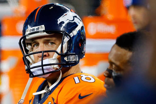 Denver Broncos' Peyton Manning watches from the bench during the second half of the NFL Super Bowl XLVIII football game against the Seattle Seahawks Sunday, Feb. 2, 2014, in East Rutherford, N.J. (AP Photo/Paul Sancya)