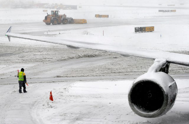THE ASSOCIATED PRESS / A snow plow clears the runway Monday, Feb. 3, 2014 at Newark Liberty International Airport in Newark, NJ. Air traffic is disrupted in Ohio, the Mid-Atlantic and the Northeast as another winter storm bears down on the eastern U.S., only a day after temperatures soared into the 50s.  (AP Photo/Matt York) 
 THE ASSOCIATED PRESS / A Patton Township, Pa., police officer walks a woman to his vehicle Monday, Feb. 3, 2014, after her she slid her car off N. Atherton Street and was stranded on top of a guard rail.  A winter storm in Centre County Monday caused heavy snowfall and dangerous travel conditions.  (AP Photo/Centre Daily Times,Nabil K. Mark) 
 THE ASSOCIATED PRESS / A snowplow moves snow off taxiways at Newark Liberty International Airport, Monday, Feb. 3, 2014, in Newark, N.J. Another round of winter weather followed a day of unseasonable temperatures with several inches of snow in the eastern United States on Monday, closing schools, disrupting air traffic and snarling travel plans for people trying to return home from the Super Bowl in the New York area.  (AP Photo/Mike Stewart)