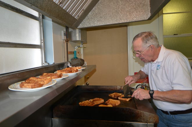 Volunteer Jerry McGhee was hard at work preparing lunch Monday.