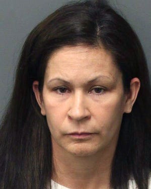 This photo released by the Riverside Police Dept. shows Andrea Michelle Cardosa, 40, who was arrested on Monday, Feb. 3, 2014 in Perris, Calif. Cardosa a former Southern California educator was jailed on felony charges that could send her to prison for life after a former female student accused her of sexual abuse in a YouTube video that's gained nearly a million views and prompted another girl to come forward. (AP Photo/Riverside Police Dept.)