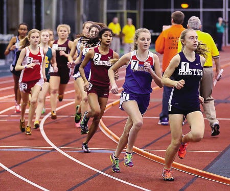 Shannon Murdock of Exeter High School, right, leads the pack, including Winnacunnet’s Mercedes McCoy, second from right, during her state record-setting run in the 1,500-meter race during Sunday’s Division I indoor championship meet at Dartmouth College in Hanover.

Matt Parker photo