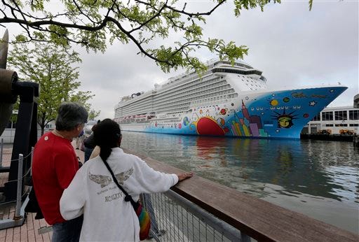FILE - In this May 8, 2013, file photo, people pause to look at Norwegian Cruise Line's new ship, Norwegian Breakaway, on the Hudson River, in New York. A 4-year-old child died after being pulled unresponsive from a swimming pool on the Norwegian Breakaway, off the coast of North Carolina on Monday, Feb. 3, 2014, cruise line and Coast Guard officials said. Crew members were able to revive a 6-year-old boy also found in the pool. He was airlifted to a hospital, where his condition was unknown. (AP Photo/Richard Drew, File)