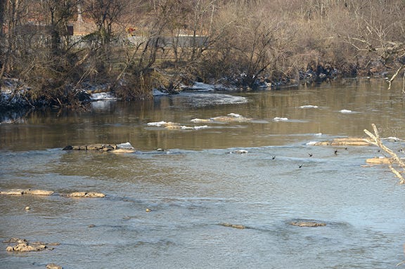 The East Burlington Wastewater Treatment Plant, top left, adjacent to the Haw River at the spill site.