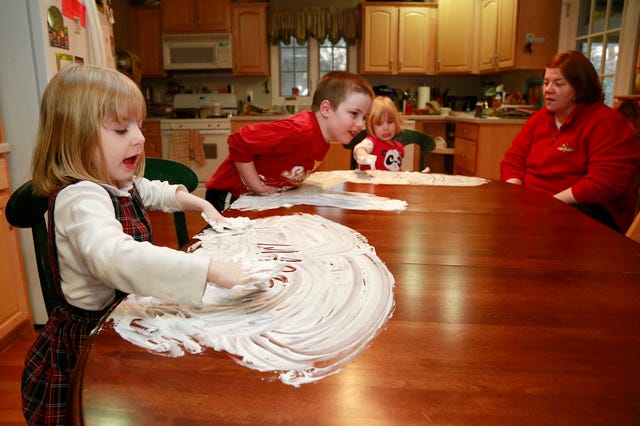 THE ASSOCIATED PRESS / Joanne Kehoe, right, watches while her children, from left, Maria, Anthony and Veronica play with shaving cream on the kitchen table while trying to combat cabin fever, Monday, Feb. 3, 2014, in Indianapolis. (AP Photo/R Brent Smith) 
 THE ASSOCIATED PRESS / Felicity Beck-Kehoe runs wearing a cape through the family home of her parents Mike Beck and Joanne Kehoe as the family tries to combat cabin fever, Monday, Feb. 3, 2014, in Indianapolis. (AP Photo/R Brent Smith) 
 THE ASSOCIATED PRESS / Mike Beck carries his daughter Veronica on his back through the family's living room as his daughter Maria, left, plays a video while trying to combat cabin fever, Monday, Feb. 3, 2014, in Indianapolis. (AP Photo/R Brent Smith)