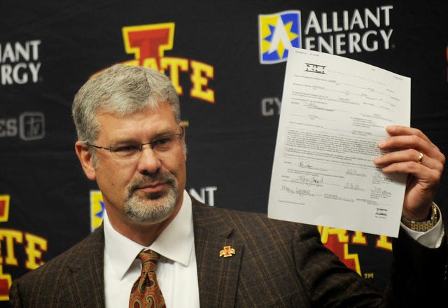 Iowa State football coach Paul Rhoads holds up the national letter of intent for Urbandale wide receiver Allen Lazard, who signed with the Cyclones on Wednesday. Photo by Nirmalendu Majumdar/Ames Tribune 
 New Iowa State recruits, from left, Luna Gabe, Devron Moore and Jordan Harris are introduced by coach Paul Rhods during a press conference Wednesday at the ISU practice facility. Photo by Nirmalendu Majumdar/Ames Tribune