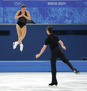 United States Marissa Castelli and Simon Shnapir perform during the team pairs figure skating short program at the Iceberg Skating Palace at the Winter Olympics in Sochi, Russia, Thursday, Feb, 6, 2014. (Harry E. Walker/MCT)