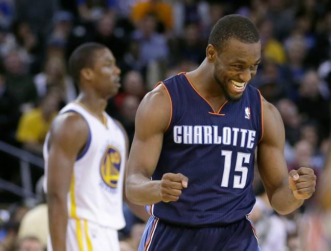 Charlotte’s Kemba Walker celebrates after scoring against the Golden State Warriors during the second half of a game in Oakland, Calif., Tuesday. The Bobcats won 91-75.