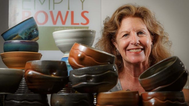 Alice Scanlon, co-chair of Empty Bowls Palm Beach County, with bowls donated by artists at the Palm Beach County Food Bank on Jan. 30, 2014. The launch of Empty Bowls Palm Beach County is set for Feb. 15 during the West Palm Beach GreenMarket. (Thomas Cordy/The Palm Beach Post)