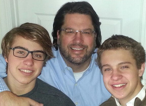 Aaron Maune, center, with sons Andrew, left, and Aidan.
