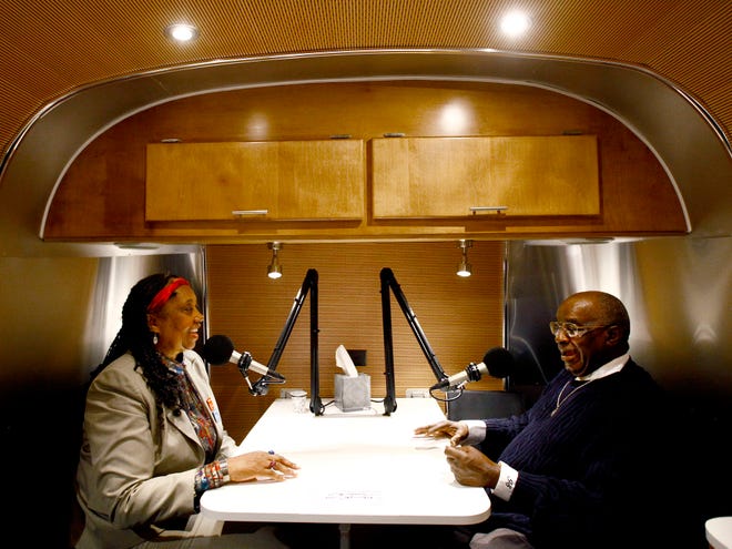 Sherry Sherrod Dupree, left, and Joe Eddie Scott talk about the history of Rosewood in the StoryCorps Mobile Booth inside an Airstream trailer on Thursday.