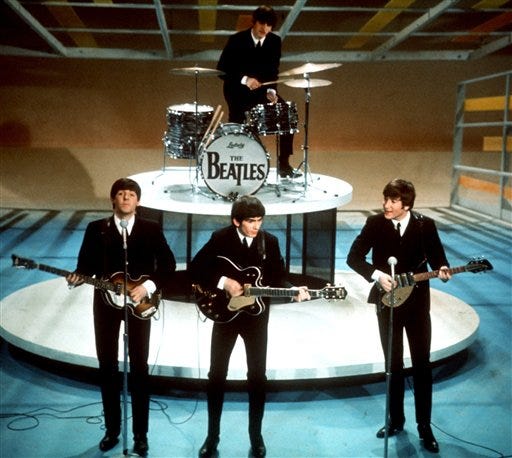 In this Feb. 9, 1964 file photo, The Beatles perform on the CBS "Ed Sullivan Show" in New York.