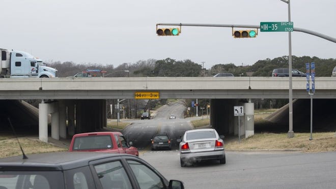Cars pass through the underpass at Woodland Avenue and Interstate 35 on Thursday. Under one plan the Texas Department of Transportation is considering, the underpass would be closed to allow the interstate to be lowered and improve sightlines.