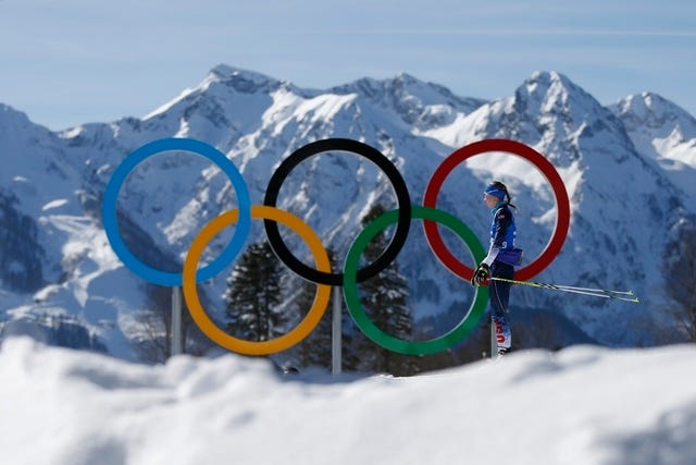 THE ASSOCIATED PRESS / Annelies Cook of the United States passes by the Olympic rings during a biathlon training session prior to the 2014 Winter Olympics, Friday, Feb. 7, 2014, in Krasnaya Polyana, Russia. (AP Photo/Felipe Dana) 
 THE ASSOCIATED PRESS / Todd Lodwick of the United States carries the national flag as he leads his team into the stadium during the opening ceremony of the 2014 Winter Olympics in Sochi, Russia, Friday, Feb. 7, 2014. (AP Photo/Patrick Semansky)