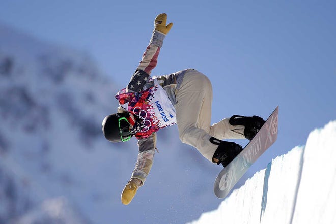 Shaun White of the United States jumps during a training session for the men's snowboard halfpipe at the 2014 Winter Olympics, Saturday, Feb. 8, 2014, in Krasnaya Polyana, Russia. (AP Photo/Jae C. Hong)