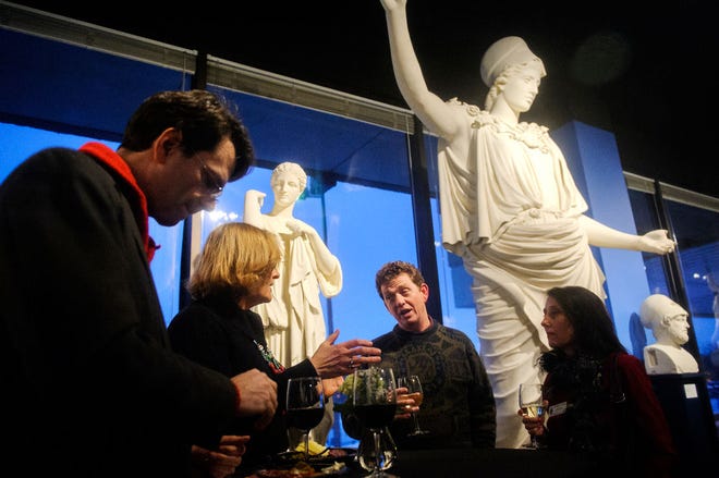 From left, Scott Christianson, Ava Fagan, James Quinn and Christiane Quinn talk among the sculptures of the Gallery of Greek and Roman Casts exhibit during a reception Friday to mark the opening of the Museum of Art and Archaeology’s new location of Mizzou North.