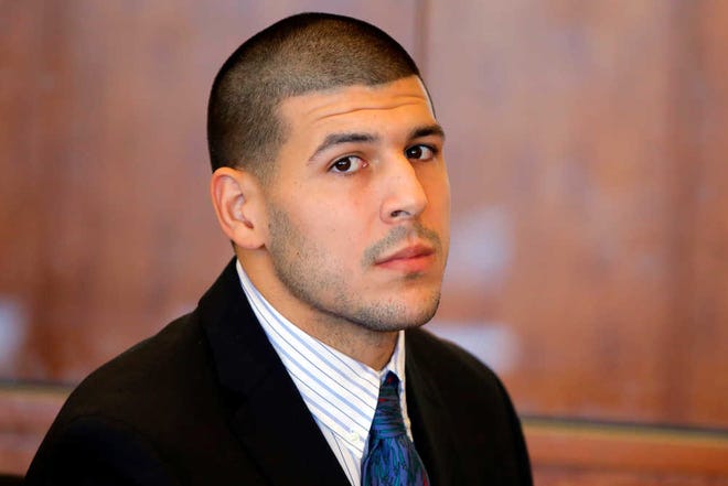 FILE - In this Oct. 9, 2013, file photo, former New England Patriots NFL football player Aaron Hernandez attends a pretrial court hearing in Fall River, Mass. Massachusetts prosecutors are seeking recordings of jailhouse phone calls by the former football player, who they say used "coded messages" to communicate about the murder case against him. Hernandez has pleaded not guilty to murder in the killing of 27-year-old Odin Lloyd. (AP Photo/Brian Snyder, Pool, File)