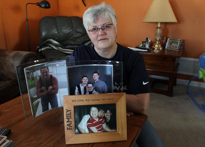 Elise Reynolds at her Pawtucket home with photos of her sons. She lost two of her three sons to drug overdoses, Paul in 2004 and Teddie in 2010. A nurse, Reynolds has spent much of her career working in methadone clinics.