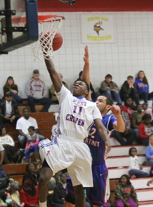 West Craven's Kylikke Green lays in two of his 13 points in Friday's 71-64 overtime loss to West Carteret.