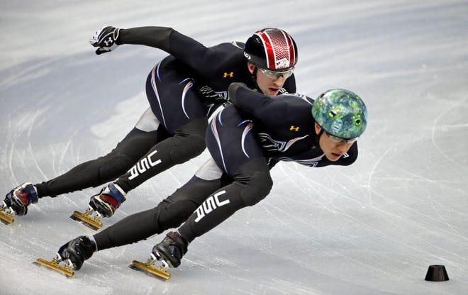 United States short track speed skating teammates J.r. Celski, right, and Christopher Creveling run through a training session at the Iceberg Skating Palace at the 2014 Winter Olympics, Sunday, Feb. 2, 2014, in Sochi, Russia. (AP Photo/David Goldman)
