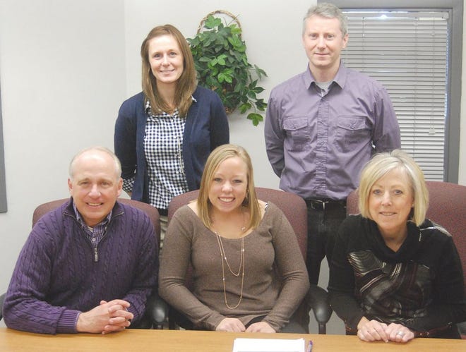 Morton High School senior Kayla Dierker, center, signed Jan. 28 with Lincoln College, where she will participate on the women's volleyball team for the Lynx. With Dierker in the main office were, in front, from left: her parents Rich and Lisa Dierker; second row: MHS volleyball head coach Jen Saylor and Lincoln volleyball head coach Mark Tippett.