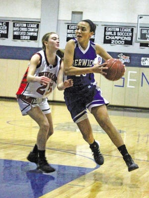 John Doyle/Foster’s Daily Democrat
Portsmouth resident Torie St. Pierre (right) drives past Winsor’s Brigitte Schmittlein during Berwick’s 46-35 win on Saturday.