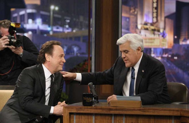 Jay Leno, right, with guest Billy Crystal during a commercial break during Leno's final show as host of "The Tonight Show" on Thursday, Feb. 6, 2014, in Burbank, Calif. (Gary Friedman/Los Angeles Times/MCT)